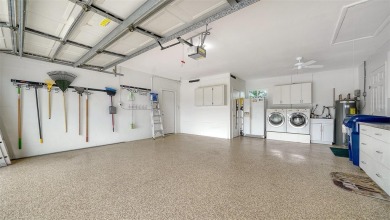 Gorgeously updated and hurricane-ready, this lakefront pool home on The Meadows Golf and Country Club in Florida - for sale on GolfHomes.com, golf home, golf lot
