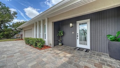 Gorgeously updated and hurricane-ready, this lakefront pool home on The Meadows Golf and Country Club in Florida - for sale on GolfHomes.com, golf home, golf lot