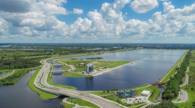 Gorgeously updated and hurricane-ready, this lakefront pool home on The Meadows Golf and Country Club in Florida - for sale on GolfHomes.com, golf home, golf lot