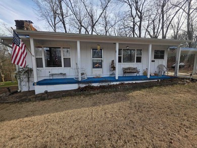 This is a must-see home with 3 bedrooms and 1 and a 1/2 baths on Cherokee Village North Course in Arkansas - for sale on GolfHomes.com, golf home, golf lot