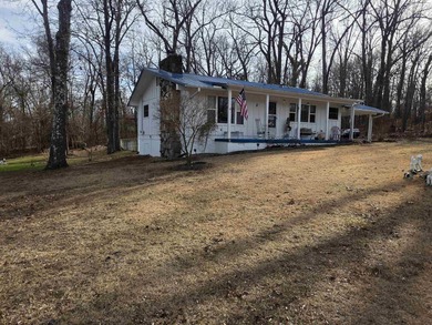 This is a must-see home with 3 bedrooms and 1 and a 1/2 baths on Cherokee Village North Course in Arkansas - for sale on GolfHomes.com, golf home, golf lot