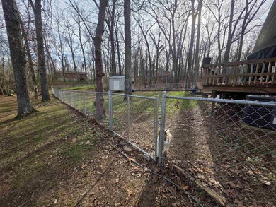 This is a must-see home with 3 bedrooms and 1 and a 1/2 baths on Cherokee Village North Course in Arkansas - for sale on GolfHomes.com, golf home, golf lot