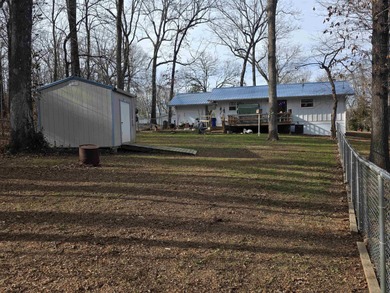 This is a must-see home with 3 bedrooms and 1 and a 1/2 baths on Cherokee Village North Course in Arkansas - for sale on GolfHomes.com, golf home, golf lot