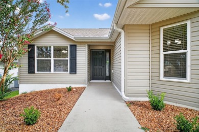 BEAUTIFULLY RENOVATED 3/2 WISTERIA MODEL with NEW ROOF (2025) on The Links of Spruce Creek in Florida - for sale on GolfHomes.com, golf home, golf lot