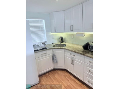 This fully renovated one-bedroom condo offers stylish comfort on Sunrise Lakes Phase III in Florida - for sale on GolfHomes.com, golf home, golf lot