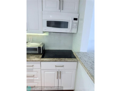 This fully renovated one-bedroom condo offers stylish comfort on Sunrise Lakes Phase III in Florida - for sale on GolfHomes.com, golf home, golf lot
