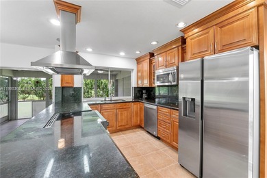 Discover Paradise. Beautifully renovated home, ideally located on The Country Club At Boca Raton in Florida - for sale on GolfHomes.com, golf home, golf lot