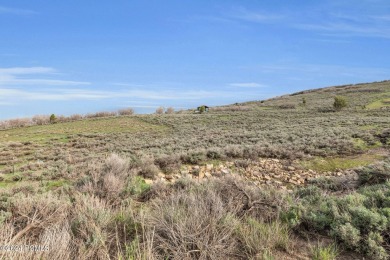 This .86-acre downhill homesite, located on a cul-de-sac with on Talisker Club At Tuhaye in Utah - for sale on GolfHomes.com, golf home, golf lot