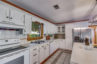 Wake up to sparkling lake views every day in this beautiful 3 on Fairfield Plantation Golf and Country Club in Georgia - for sale on GolfHomes.com, golf home, golf lot