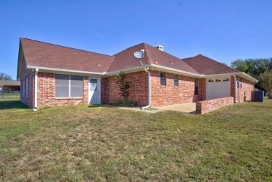 This beautiful 3-bedroom, 3-bathroom brick home in the heart of on Cedar Creek Country Club in Texas - for sale on GolfHomes.com, golf home, golf lot