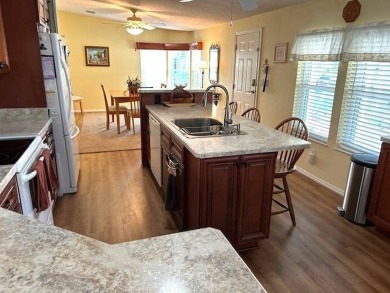 Welcome to your dream home in a vibrant 55+ community! This on Crystal Lake Club in Florida - for sale on GolfHomes.com, golf home, golf lot