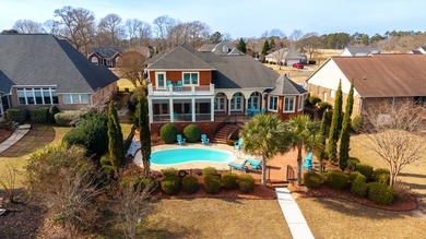 Wake up to shimmering water views in this stunning waterfront on Players Course At Wyboo Plantation in South Carolina - for sale on GolfHomes.com, golf home, golf lot