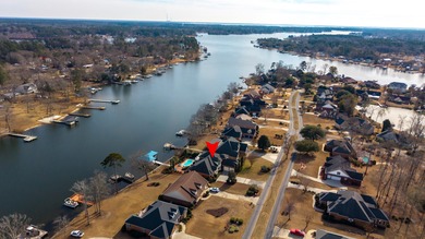 Wake up to shimmering water views in this stunning waterfront on Players Course At Wyboo Plantation in South Carolina - for sale on GolfHomes.com, golf home, golf lot