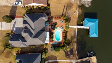 Wake up to shimmering water views in this stunning waterfront on Players Course At Wyboo Plantation in South Carolina - for sale on GolfHomes.com, golf home, golf lot