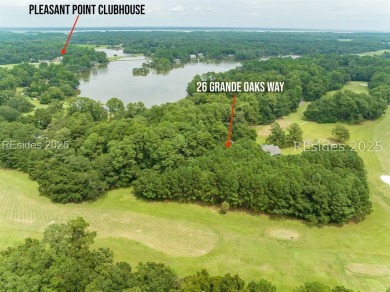 Large wooded lot located in Pleasant Point Plantation situated on The Golf Club at Pleasant Point Plantation in South Carolina - for sale on GolfHomes.com, golf home, golf lot