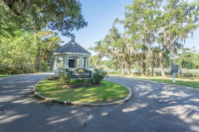 Large wooded lot located in Pleasant Point Plantation situated on The Golf Club at Pleasant Point Plantation in South Carolina - for sale on GolfHomes.com, golf home, golf lot