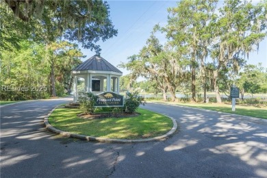 Large wooded lot located in Pleasant Point Plantation situated on The Golf Club at Pleasant Point Plantation in South Carolina - for sale on GolfHomes.com, golf home, golf lot
