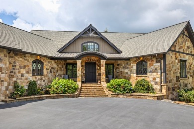 This custom home is noteworthy for its elegant stone facade on Cullasaja Club in North Carolina - for sale on GolfHomes.com, golf home, golf lot