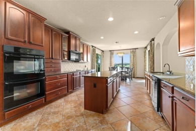 Welcome to this WATERFRONT GEM with 6 bedrooms and 4 full on Oaks National Golf Course in Florida - for sale on GolfHomes.com, golf home, golf lot