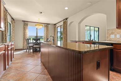 Welcome to this WATERFRONT GEM with 6 bedrooms and 4 full on Oaks National Golf Course in Florida - for sale on GolfHomes.com, golf home, golf lot