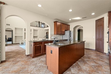 Welcome to this WATERFRONT GEM with 6 bedrooms and 4 full on Oaks National Golf Course in Florida - for sale on GolfHomes.com, golf home, golf lot