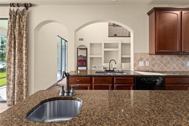 Welcome to this WATERFRONT GEM with 6 bedrooms and 4 full on Oaks National Golf Course in Florida - for sale on GolfHomes.com, golf home, golf lot
