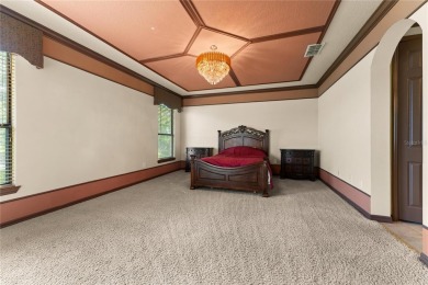 Welcome to this WATERFRONT GEM with 6 bedrooms and 4 full on Oaks National Golf Course in Florida - for sale on GolfHomes.com, golf home, golf lot