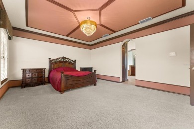 Welcome to this WATERFRONT GEM with 6 bedrooms and 4 full on Oaks National Golf Course in Florida - for sale on GolfHomes.com, golf home, golf lot
