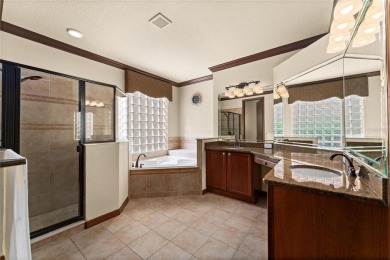 Welcome to this WATERFRONT GEM with 6 bedrooms and 4 full on Oaks National Golf Course in Florida - for sale on GolfHomes.com, golf home, golf lot
