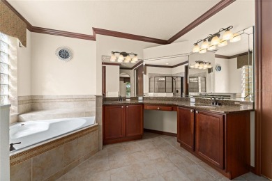 Welcome to this WATERFRONT GEM with 6 bedrooms and 4 full on Oaks National Golf Course in Florida - for sale on GolfHomes.com, golf home, golf lot