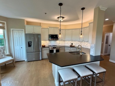 Discover one of the most desirable condos in Rarity Bay on Rarity Bay Country Club - Loudon in Tennessee - for sale on GolfHomes.com, golf home, golf lot