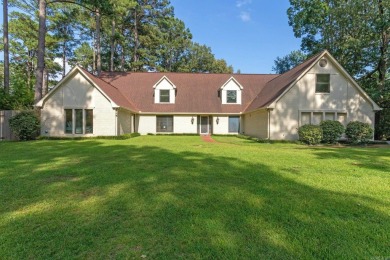 This charming Tudor style home is nestled on a large private lot on Pine Bluff Country Club in Arkansas - for sale on GolfHomes.com, golf home, golf lot