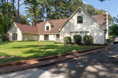 This charming Tudor style home is nestled on a large private lot on Pine Bluff Country Club in Arkansas - for sale on GolfHomes.com, golf home, golf lot