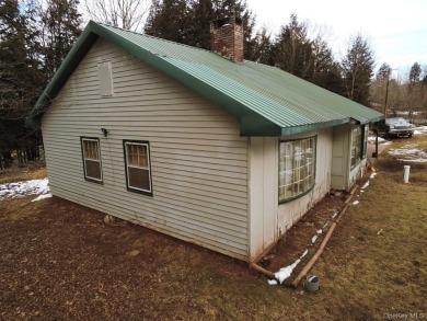 Sold as is.

3 minutes to the ski slopes and across the street on Windham Country Club in New York - for sale on GolfHomes.com, golf home, golf lot