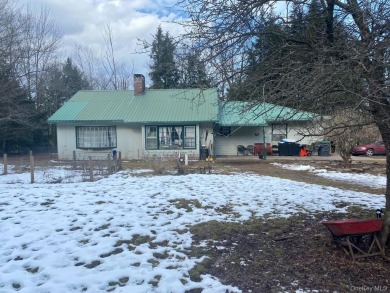 Sold as is.

3 minutes to the ski slopes and across the street on Windham Country Club in New York - for sale on GolfHomes.com, golf home, golf lot