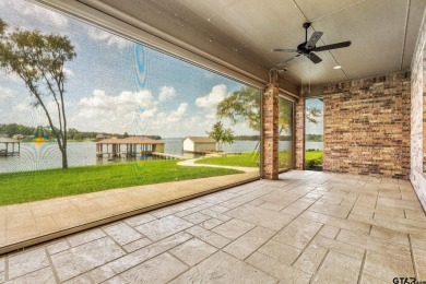 Step into the grand entrance of this exquisite lakehouse and be on Emerald Bay Club in Texas - for sale on GolfHomes.com, golf home, golf lot