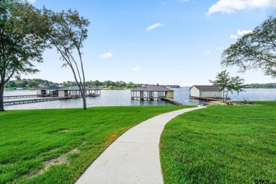 Step into the grand entrance of this exquisite lakehouse and be on Emerald Bay Club in Texas - for sale on GolfHomes.com, golf home, golf lot