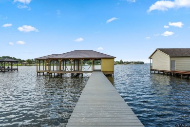 Step into the grand entrance of this exquisite lakehouse and be on Emerald Bay Club in Texas - for sale on GolfHomes.com, golf home, golf lot