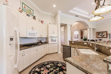 This stunning Mediterranean style stucco home is on a golf on Venetian Golf and River Club in Florida - for sale on GolfHomes.com, golf home, golf lot