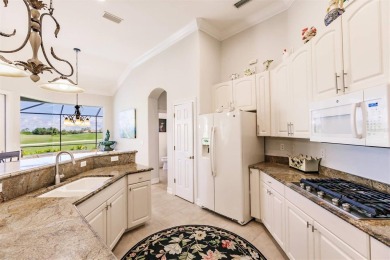 This stunning Mediterranean style stucco home is on a golf on Venetian Golf and River Club in Florida - for sale on GolfHomes.com, golf home, golf lot