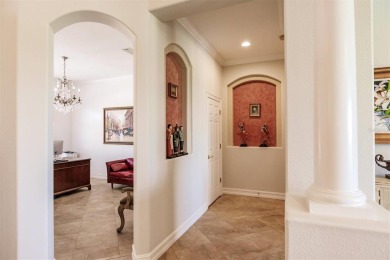 This stunning Mediterranean style stucco home is on a golf on Venetian Golf and River Club in Florida - for sale on GolfHomes.com, golf home, golf lot