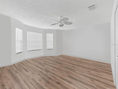 Spacious 3/2 Juniper in Sunset Pointe with Enclosed Lanai on The Links of Spruce Creek in Florida - for sale on GolfHomes.com, golf home, golf lot