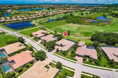 This stunning Mediterranean style stucco home is on a golf on Venetian Golf and River Club in Florida - for sale on GolfHomes.com, golf home, golf lot