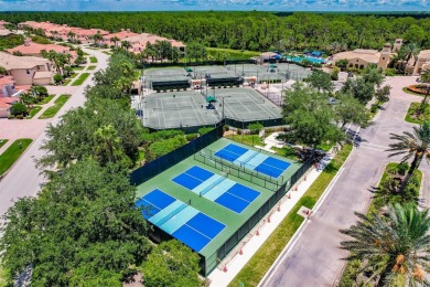 This stunning Mediterranean style stucco home is on a golf on Venetian Golf and River Club in Florida - for sale on GolfHomes.com, golf home, golf lot