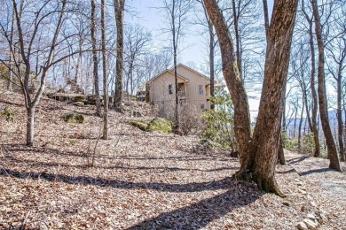 Discover your mountain retreat offering sweeping views of Lake on Lake Toxaway Country Club in North Carolina - for sale on GolfHomes.com, golf home, golf lot