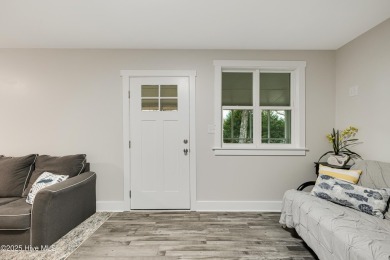 Renovated home with 2 Screened porches!  Enjoy this single-story on Founders Club At St. James Plantation in North Carolina - for sale on GolfHomes.com, golf home, golf lot