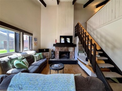 Charming and well-maintained end-unit condo featuring a cozy on Big Sky of Montana Golf Course in Montana - for sale on GolfHomes.com, golf home, golf lot