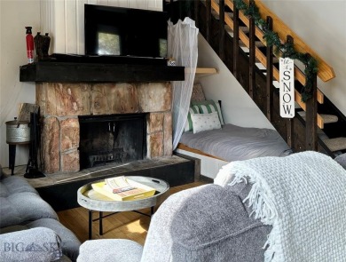 Charming and well-maintained end-unit condo featuring a cozy on Big Sky of Montana Golf Course in Montana - for sale on GolfHomes.com, golf home, golf lot
