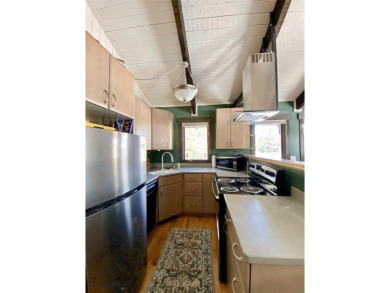Charming and well-maintained end-unit condo featuring a cozy on Big Sky of Montana Golf Course in Montana - for sale on GolfHomes.com, golf home, golf lot