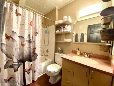 Charming and well-maintained end-unit condo featuring a cozy on Big Sky of Montana Golf Course in Montana - for sale on GolfHomes.com, golf home, golf lot